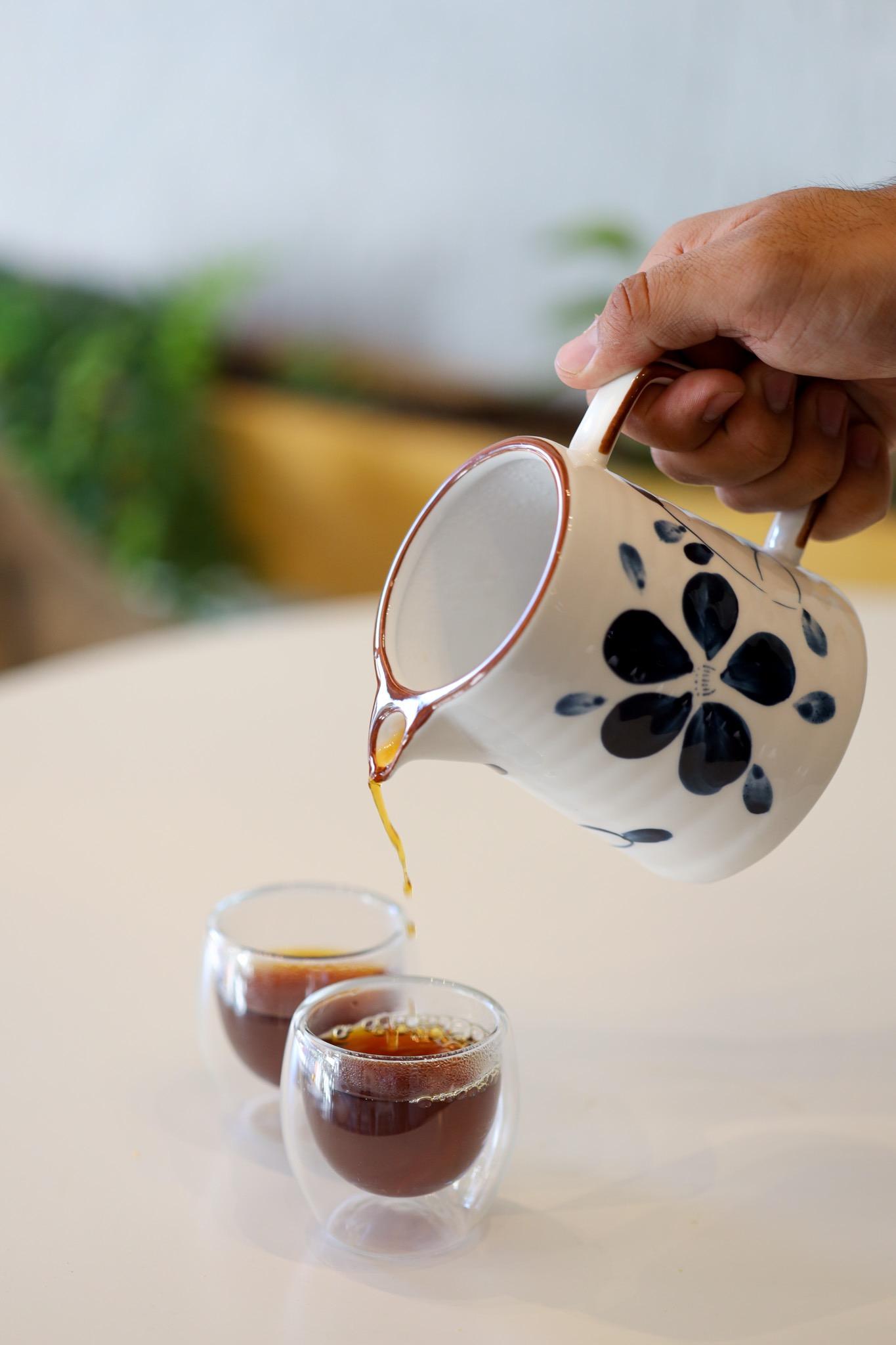 Coffee poured from a Talavera jug